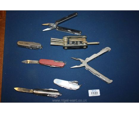 A quantity of multi-tools, allen keys, Swiss army knife, etc.