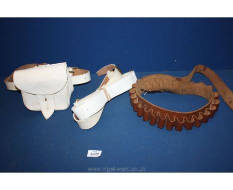 A brown leather cartridge belt with buckle and a British army ammo pouch, belt and webbing strap.