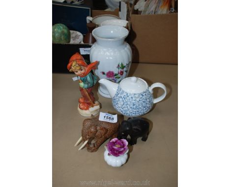 A Royale Stratford china posy, two elephant wooden figures and girl with snow shovel figurine, teapot and vase.