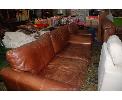 A three seater brown Leather upholstered Settee and matching chair