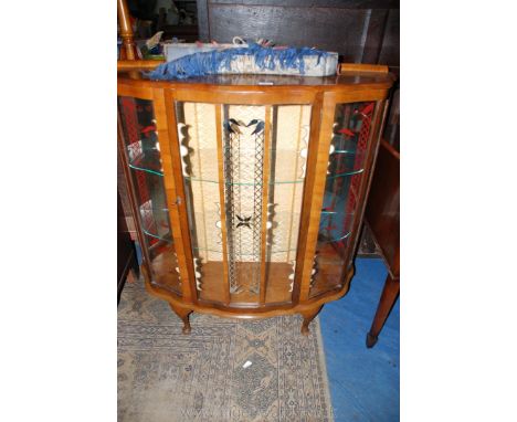 A 1940's/50's Walnut finished bow fronted china display Cabinet standing on brief cabriole legs, 41" wide x 14" deep x 45" hi