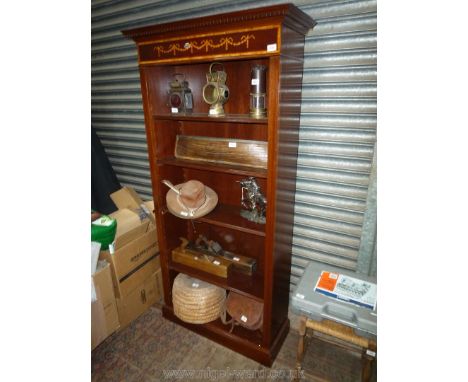 An attractive Mahogany floorstanding Bookshelves of Edwardian design having adjustable shelves, dentil frieze, cross banded l