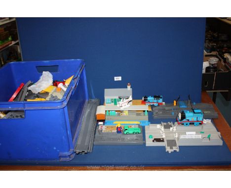 A quantity of Tomy track including cross roads, Elsbridge station and Thomas the tank engine trains etc.