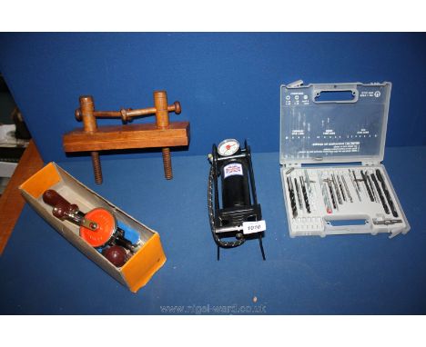 A Stanley 803 hand drill together with a case of drill bits, a car foot pump and wooden vice.