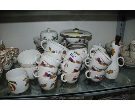 A Royal Worcester ''Evesham'' part Dinner service including seven large cups, ten large saucers, twelve cups and twelve sauce