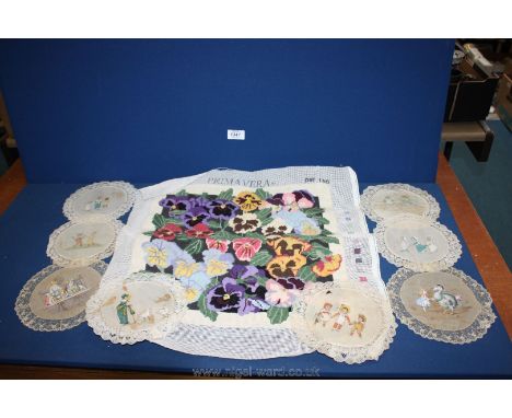 A tapestry of Pansy designed by Joanne Allen and Victorian doylies with pictorial detail.
