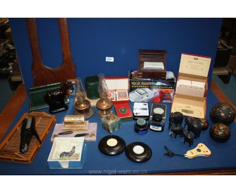 A quantity of miscellanea including playing cards, desk calendar, Avon aftershave bottle, card shuffler etc