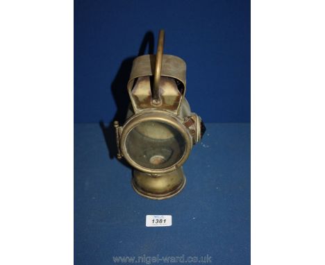 A Brass vehicle Lamp having a brass plate attached: "G. Ducellier Lanternes, Paris". Numbered 882 and having a faceted red si