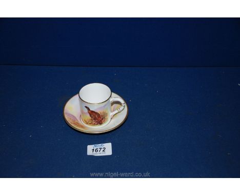 A Royal Worcester J. Stinton small Cup and saucer,with pheasant design.