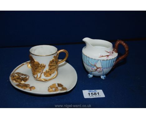 A small 19th Century aesthetic shape jug together with a Royal Worcester porcelain cup and saucer decorated with gilded ivy d