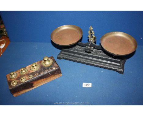Weighing scales together with weights.