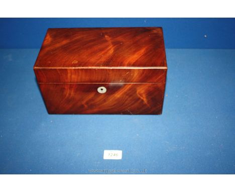 An antique Flame Mahogany tea caddy.