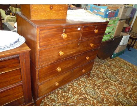 A circa 1900 Mahogany Chest of three long and two short Drawers having turned wood handles and standing on shaped bracket fee