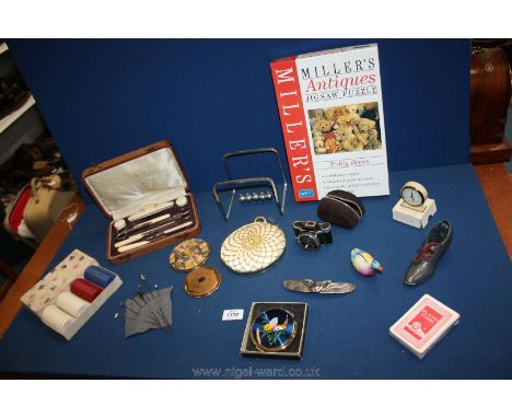 A quantity of miscellanea to include Lumiere mini camera, three compacts, shoe pin cushion, Millers jigsaw, hat pins, buckle,