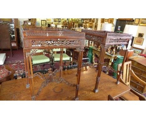 A pair of Chippendale style mahogany side tables, with carved and pierced gallery top, candle slide, fret work border, raised