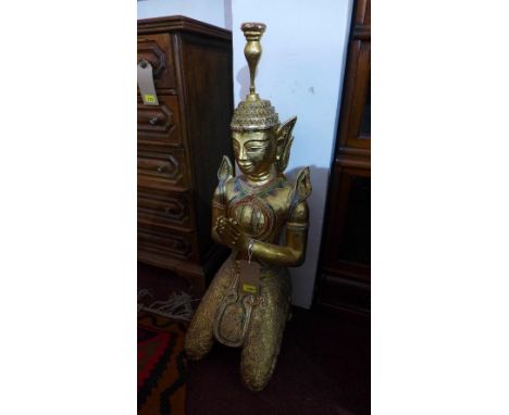 A gilt wood statue of a praying Tibetan Buddha, decorated with multi coloured glass pieces, H.93cm 