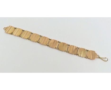 A square link bracelet, each link with engine turned decoration, marked '9ct', 19.5cm long, 14.9g gross