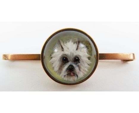 An Essex crystal bar brooch, the central panel decorated with a portrait of a white West Highland Terrier, the bar marked '9c