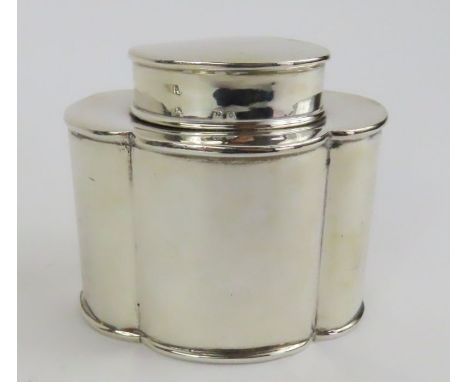 A silver tea caddy, makers mark worn, Birmingham 1913, of oval shaped outline with pull off cover, approximately 8 cm high, 1