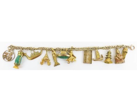 A double curb link bracelet, marked '9c', 19cm long; with various charms attached, to include a lantern with an aventurine qu