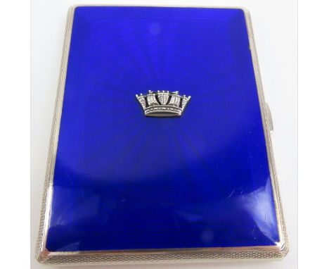 A silver and enamel cigarette case, the royal blue guilloche enamel with a naval crown over laid, the rest of the case with e
