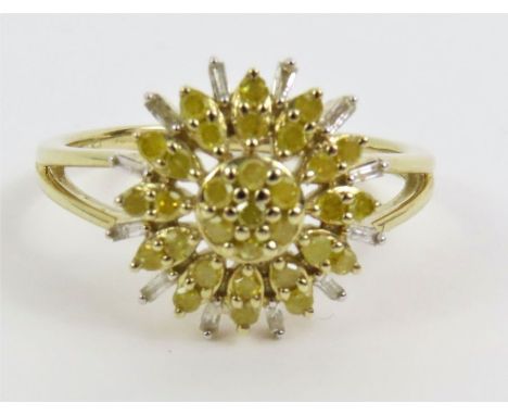 A 9ct gold white and treated yellow diamond dress ring, the stones set into a stylised sunflower design, finger size R 1/2, 3