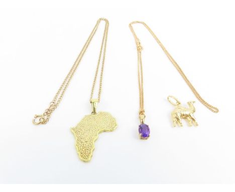 A pendant in the form of the continent of Africa decorated with a giraffe in black enamel, marked '9ct'; an amethyst pendant 