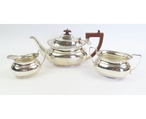 A three piece silver tea service, by Charles Perry &amp; Co, Chester 1930, of rounded rectangular outline with gadrooned bord