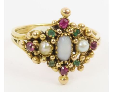 A dress ring set with opal, ruby and emeralds, finger size N 1/2, tests as 14-15ct gold, 3.1g gross