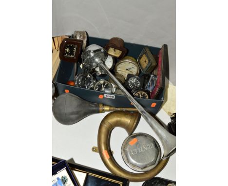 A BOX OF MOTOR CAR CLOCKS to include Ford bakelite examples, Smiths, Kienzel of Germany, an Air Ministry bakelite aircraft cl