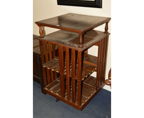 AN EARLY 20TH CENTURY OAK REVOLVING BOOKCASE, with open shelf below the top and the eight bookshelves bearing ivorine numbers