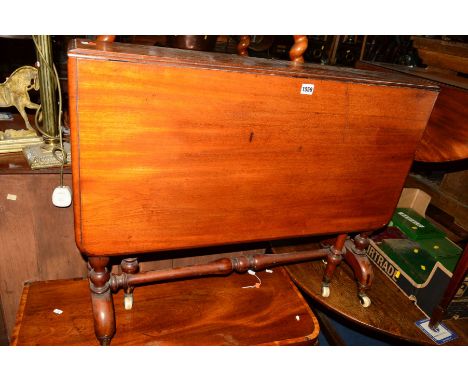 A VICTORIAN WALNUT SUTHERLAND TABLE on a stretchered base with ceramic casters