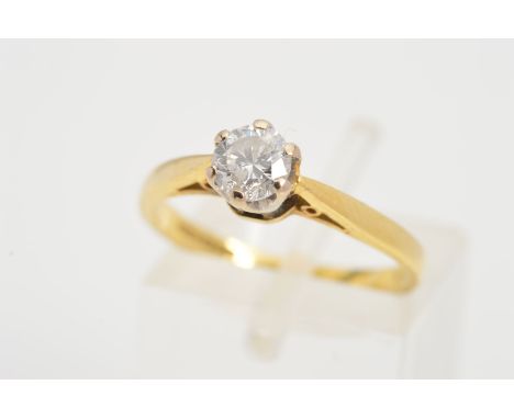 AN 18CT GOLD SINGLE ROUND DIAMOND RING, the brilliant cut diamond within a six claw setting to the tapered shoulders, stamped