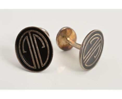 A PAIR OF SILVER TIFFANY &amp; CO CUFFLINKS, each of oval design with black cloisonne enamel detail to the fixed backs, with 