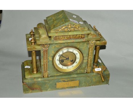 A LATE VICTORIAN/EDWARDIAN GREEN ONYX MANTEL CLOCK OF ARCHITECTURAL FORM, brass mounts including presentation plaque, enamel 