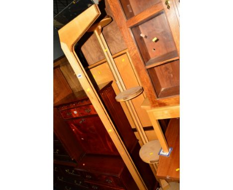 A DECORATIVE LIGHT OAK UPLIGHTER, together with a matching four tier stand with circular shelves, and a two door bookcase top