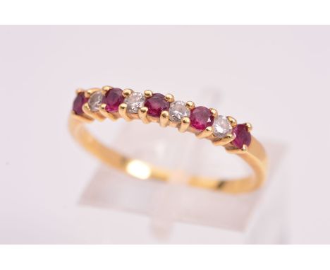 AN 18CT DIAMOND AND RUBY RING, designed as a half eternity ring, featuring four round brilliant cut diamonds interspaced by f