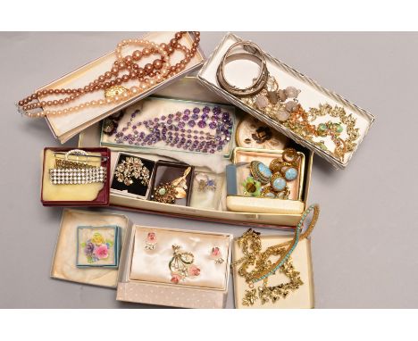 A BOX OF COSTUME JEWELLERY, to include two silver hinged bangles, a three pence coin bracelet, a floral compact, imitation pe