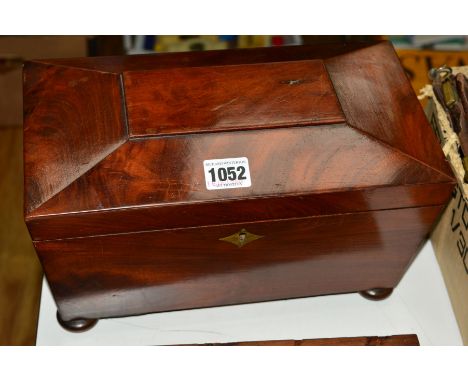 A SARCOPHAGUS SHAPED TEA CADDY ON BUN FEET, lacking mixing bowl and key, restored interior