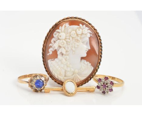 FOUR ITEMS OF JEWELLERY, to include an oval cameo brooch depicting a lady in profile within a rope twist surround, an opal ba