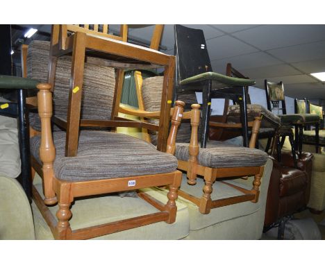 A PAIR OF ERCOL PINE FIRESIDE CHAIRS