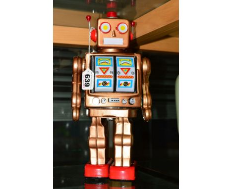 A LATE 20TH CENTURY TIN PLATE BATTERY OPERATED ROBOT, with walking action and panels on chest open with noise and lights mech