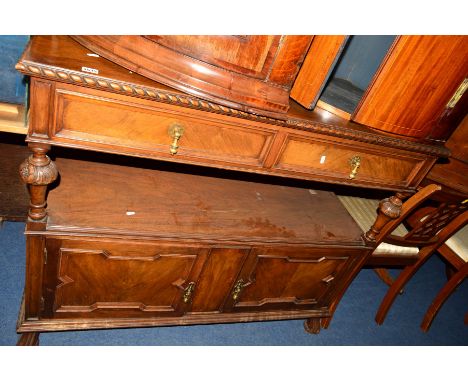 AN EDWARDIAN WALNUT TWO TIER BUFFET, raised back above two drawers, central shelf above double cupboard doors, width 122cm x 