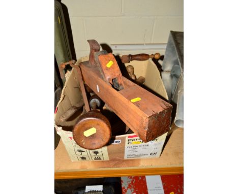 A BOX CONTAINING VARIOUS HAND TOOLS, a wooden planer, wooden mallet, spanner, measuring devices, etc