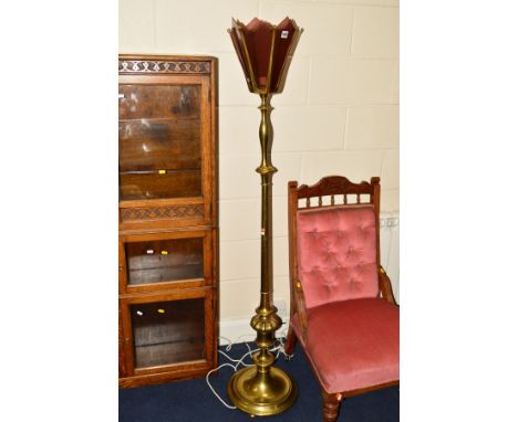 A BRASS STANDARD LAMP, six panel amethyst glass shade on a tapered cylindrical stem with urn shaped pedestal and circular bas