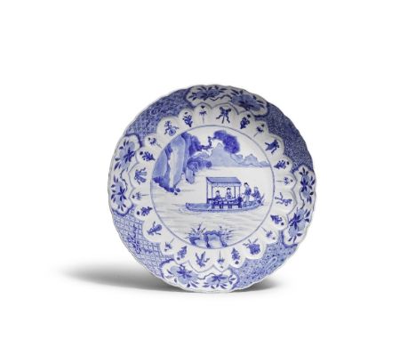 A MOULDED BLUE AND WHITE 'ODE TO THE RED CLIFF' DISHXuande six-character mark, KangxiDecorated to the centre with Su Dongpo a