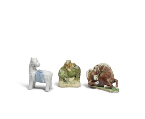 AN AUBERGINE AND GREEN GLAZED BISCUIT HORSE AND UNDERGLAZE BLUE HORSEKangxiThe biscuit horse recumbent on a green-glazed base