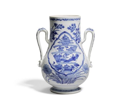 A BLUE AND WHITE TWO-HANDLED VASEKangxi The pear-shaped body rising from a splayed foot to a wide neck, decorated with floral