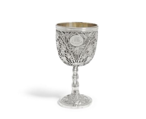 A CHINESE EXPORT SILVER 'BAMBOO' STEM CUP19th centuryThe goblet body chased with dense bamboo branches and leaves surrounding