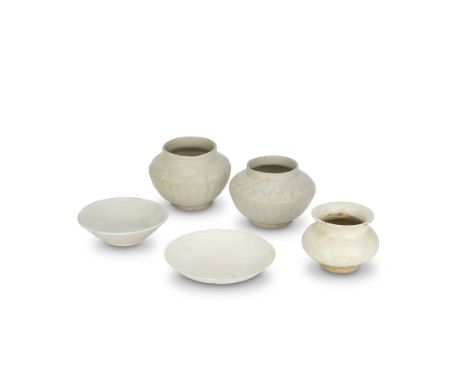 A DINGYAO BOWL AND FOUR WHITE-GLAZED VESSELSSong DynastyComprising: a Dingyao shallow flaring bowl; a white glazed flower-for